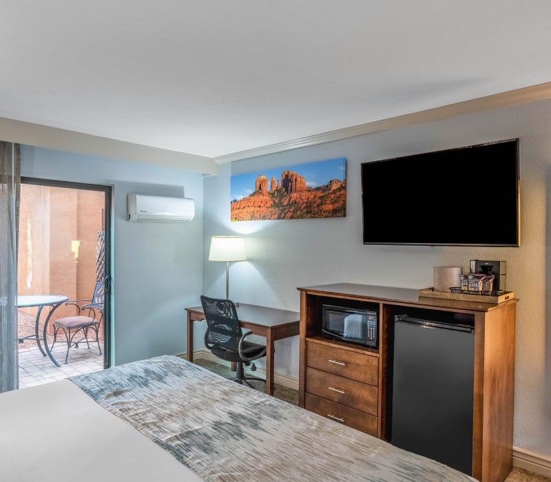 1 King Bed Whirlpool Suite at Arroyo Pinion Boutique Hotel featuring TV, modern amenities, and a private whirlpool for ultimate comfort