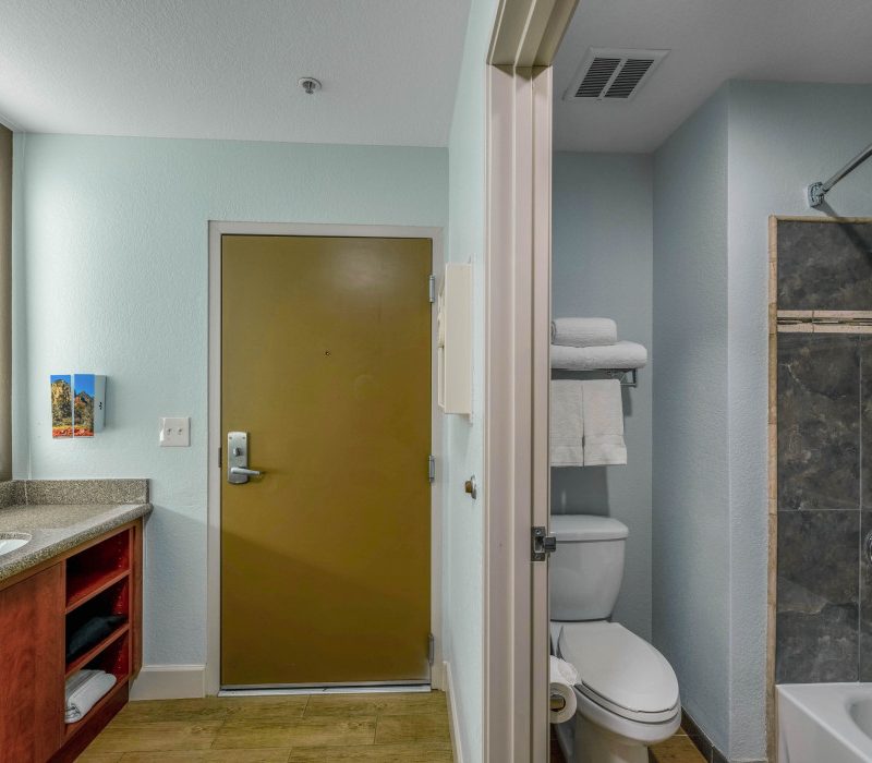 Spacious and modern 1 King Bed bathroom at Arroyo Pinion Boutique Hotel, featuring luxury amenities and stylish design