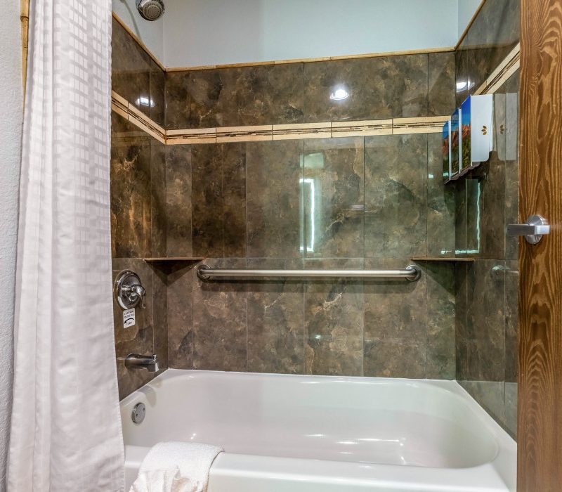 Private bathroom in the 1 Queen Bed room at Arroyo Pinion Boutique Hotel, featuring modern amenities and elegant design