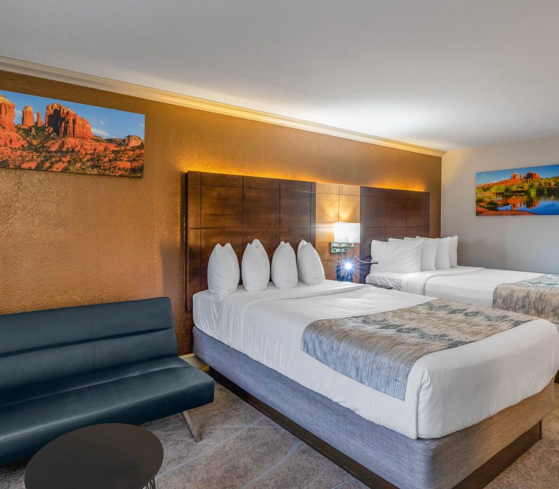 Spacious 2 Queen Beds guest room at Arroyo Pinion Boutique Hotel with modern comforts and relaxing ambiance