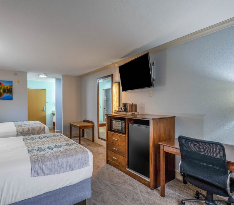 Comfortable 2 Queen Beds room at Arroyo Pinion Boutique Hotel, featuring modern amenities and cozy bedding for a relaxing stay