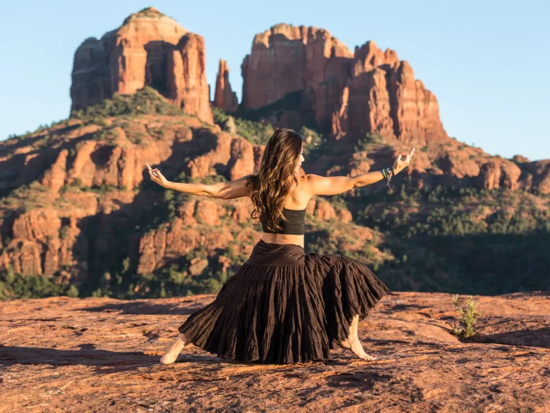 Guest dancing with scenic Red Rock views near Arroyo Pinion Boutique Hotel Sedona