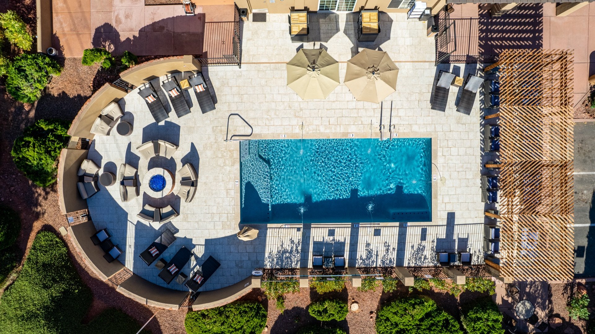 Aerial view of the pool deck and cabana seating