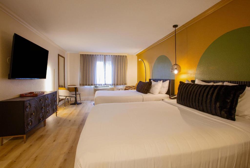 Room with Two Queen Beds and Sofa