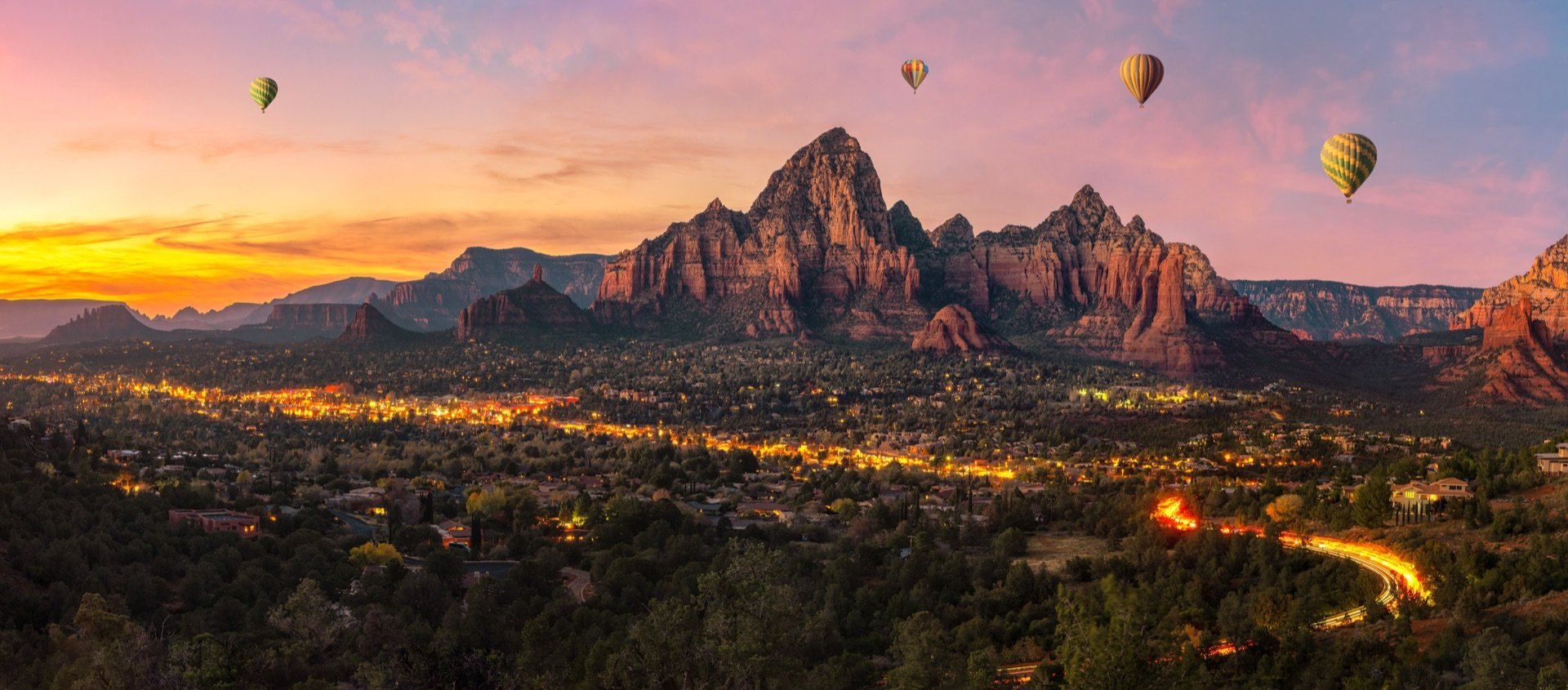 Hot air balloons over Sedona at sunset
