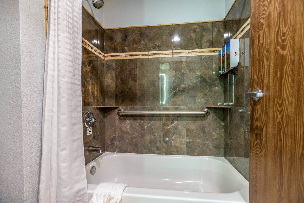 Private bathroom in the 1 Queen Bed room at Arroyo Pinion Boutique Hotel, featuring modern amenities and elegant design