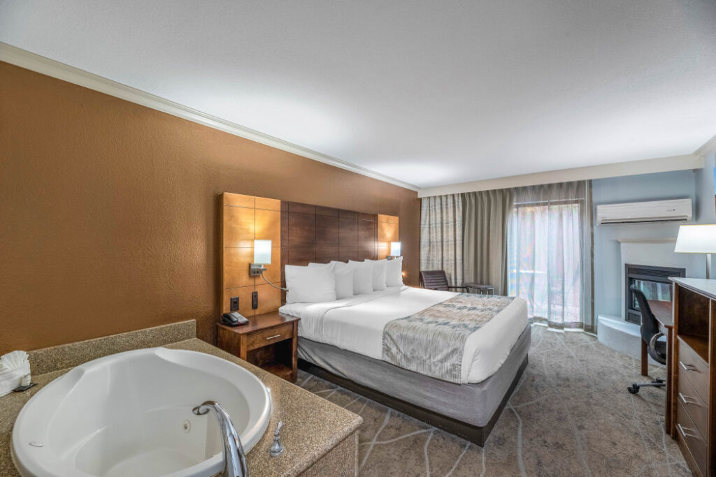 King whirlpool suite with fireplace at Arroyo Pinion, an Ascend Collection Hotel