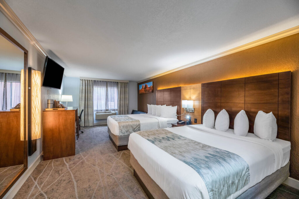 Spacious 2 Queen Beds guest room at Arroyo Pinion Boutique Hotel with modern comforts and relaxing ambiance