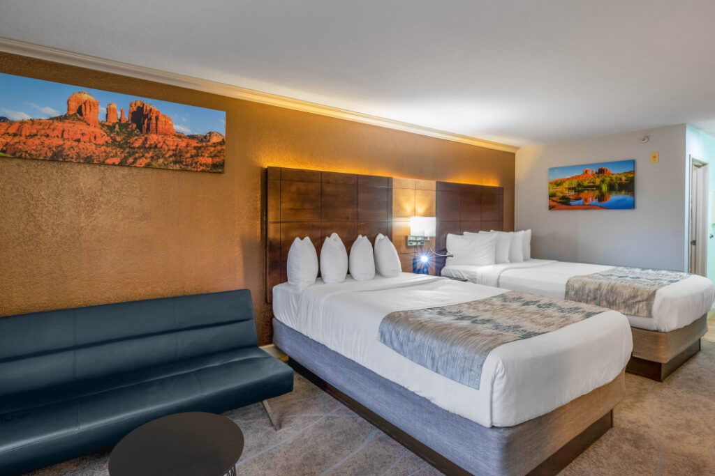 Spacious 2 Queen Beds guest room at Arroyo Pinion Boutique Hotel with modern comforts and relaxing ambiance