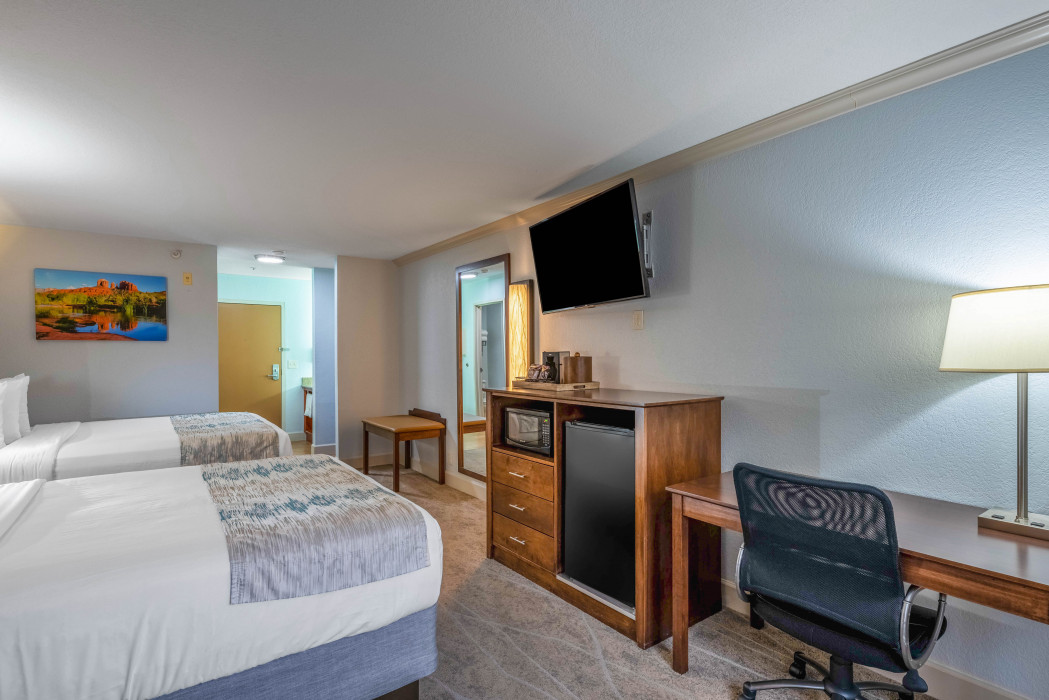 Comfortable 2 Queen Beds room at Arroyo Pinion Boutique Hotel, featuring modern amenities and cozy bedding for a relaxing stay