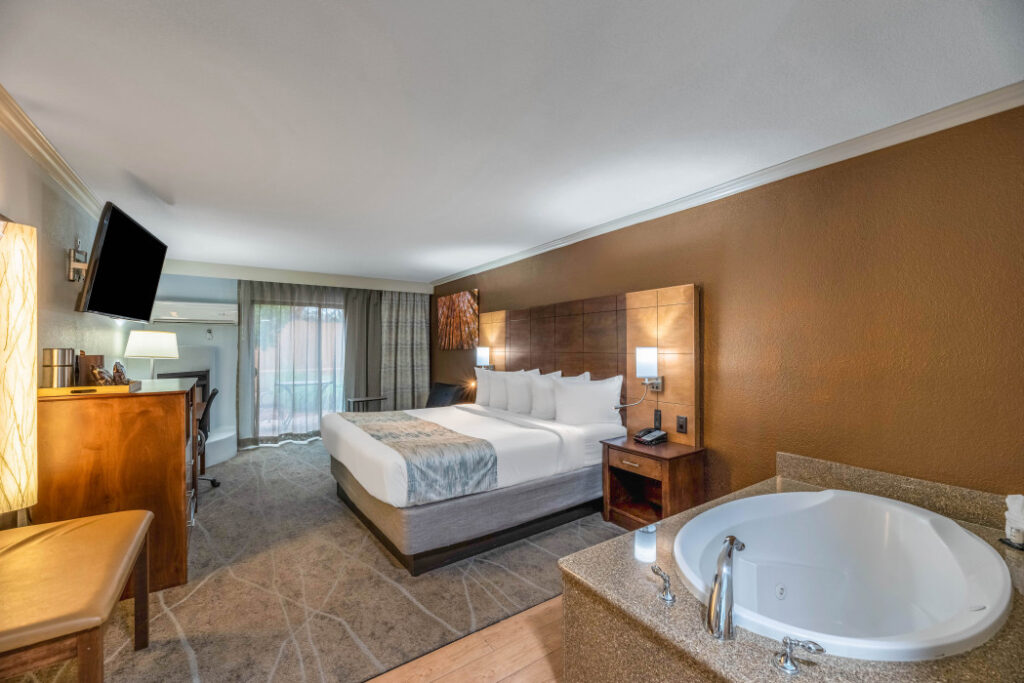 Spacious King Whirlpool Suite with fireplace and whirlpool tub at Arroyo Pinion Boutique Hotel Sedona