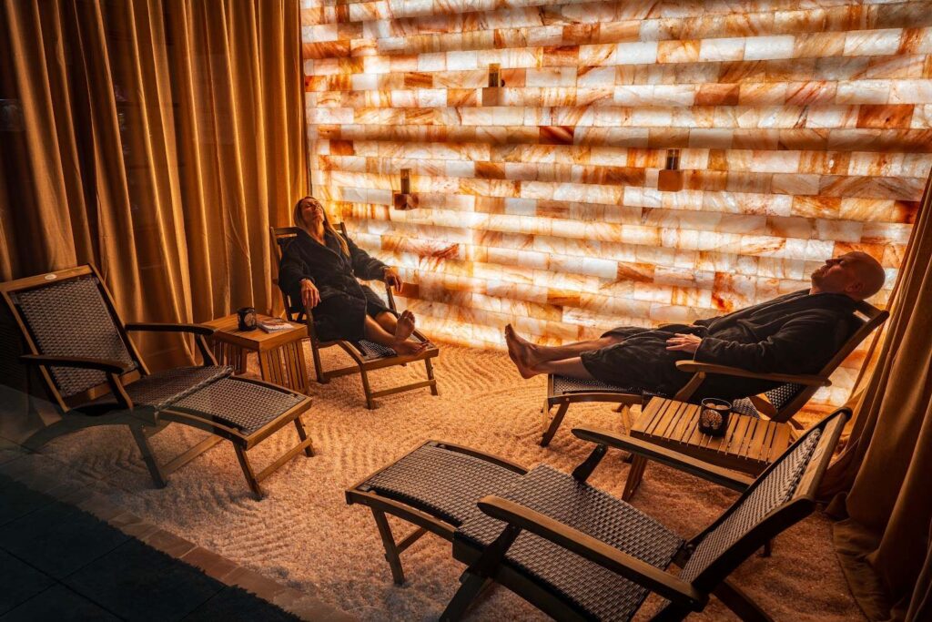 Guests relaxing in the Himalayan salt room at Arroyo Pinion, an Ascend Collection Hotel