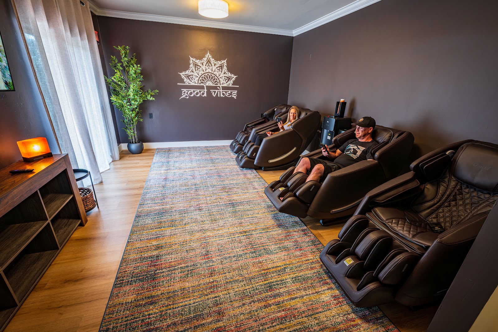 Guest relaxing in the massage chairs inside Arroyo Pinion’s Relaxation Room